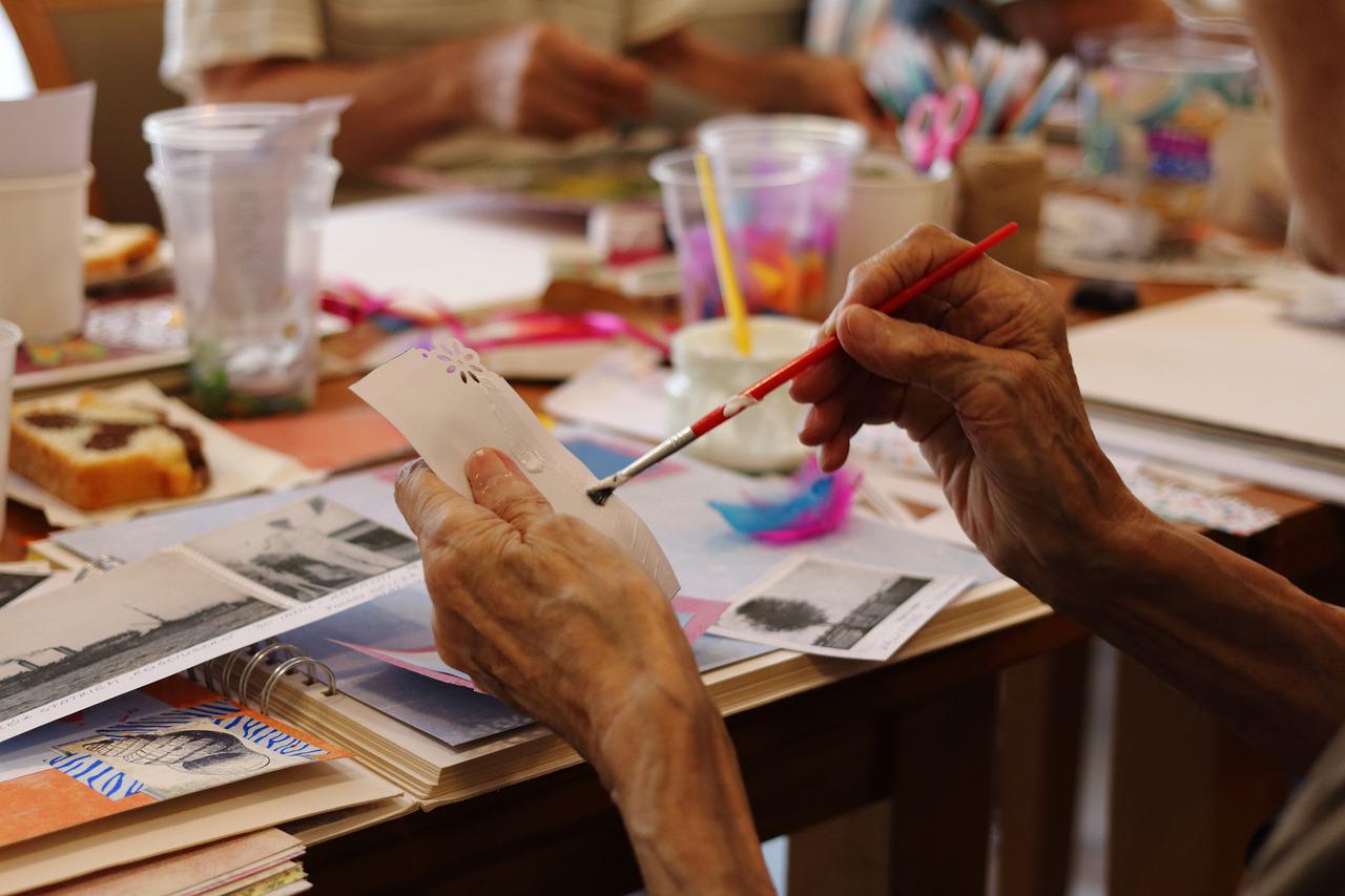 image of people's hands working at crafts