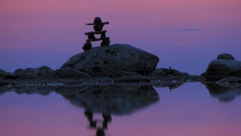 image of inukshuk at dusk